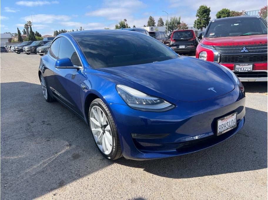 2020 Tesla Model 3 — rear three-quarter view