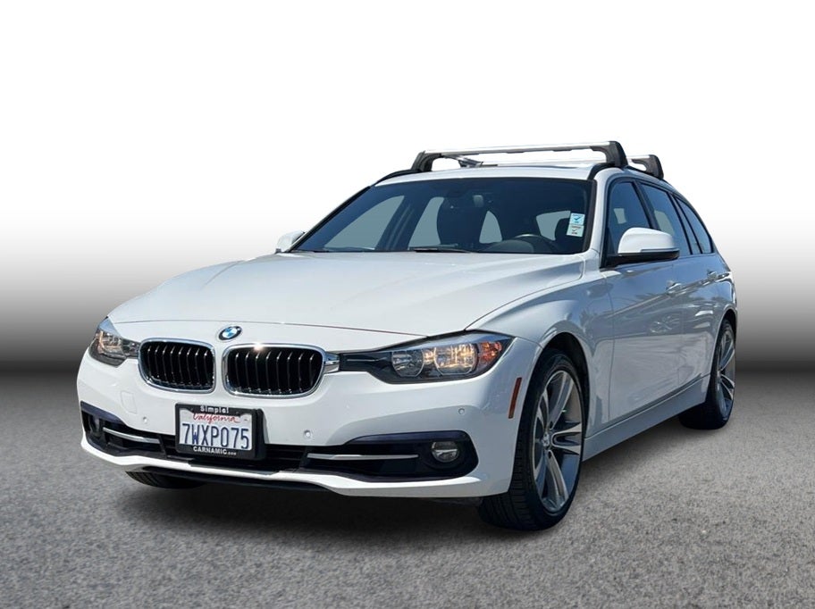 2017 BMW 3 Series 330i xDrive Sport Wagon 4D in White — front three-quarter view